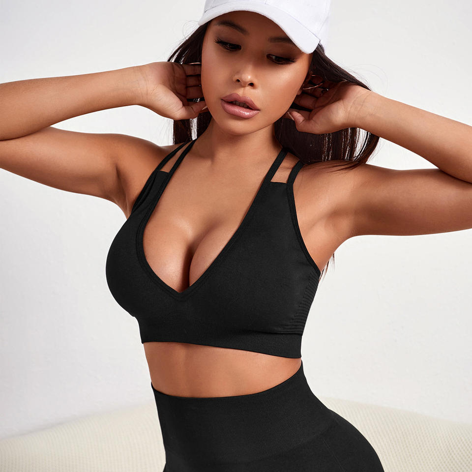 Black cross-back sports bra worn by a model