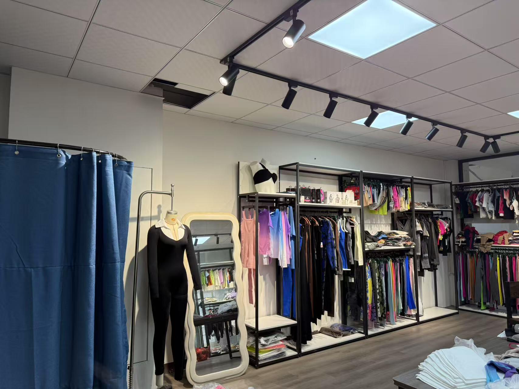 Bodysuit and activewear samples displayed in the Yiwu showroom